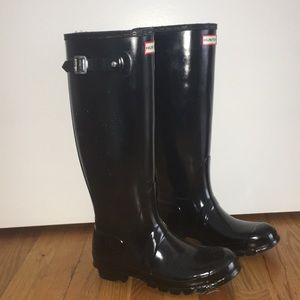 Shiny black hunter boots